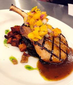 Featured Dish- Brined Smoky Pork Chop with Honey Thyme Jus and Grilled Peach Relish